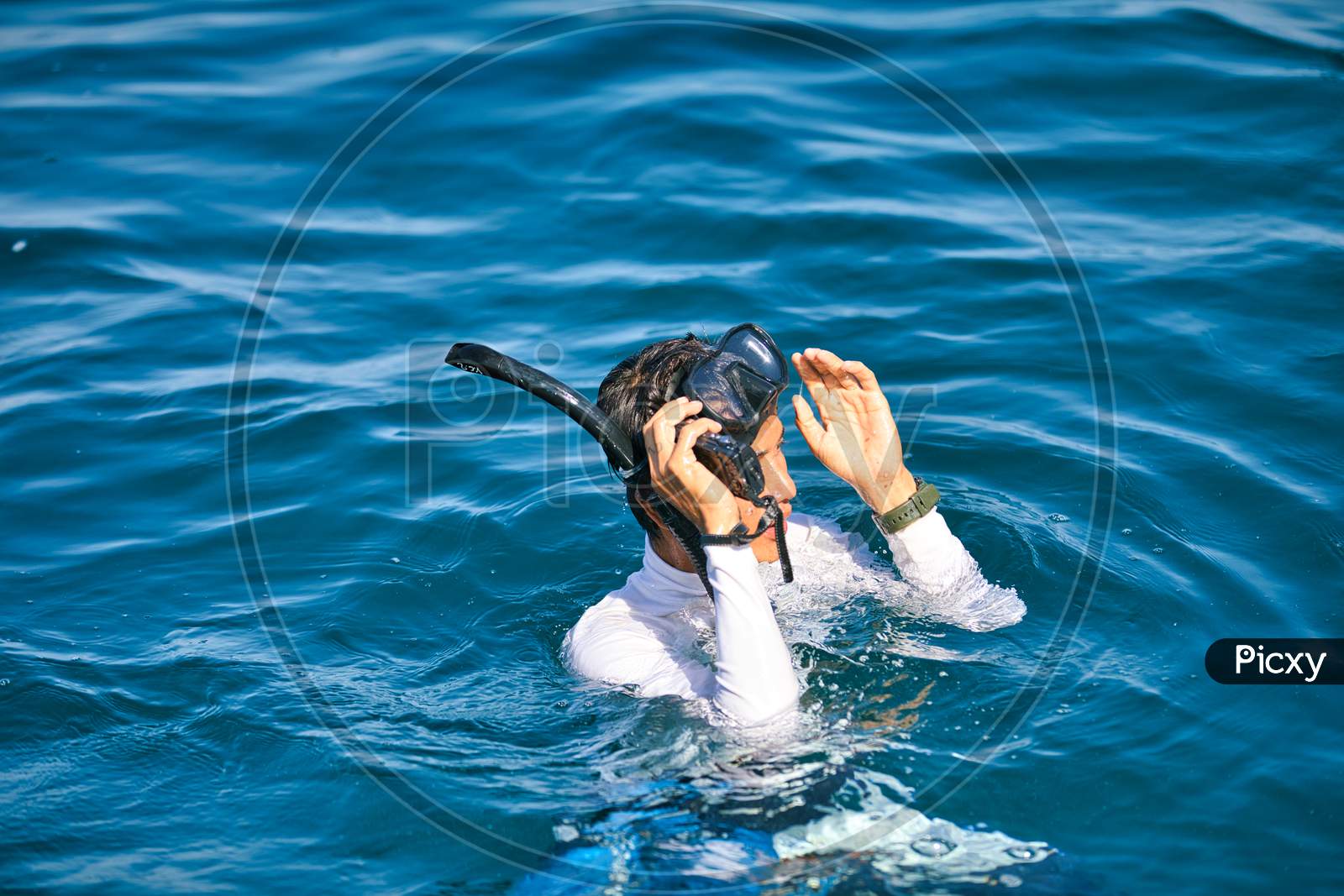 A Person swimming in an ocean