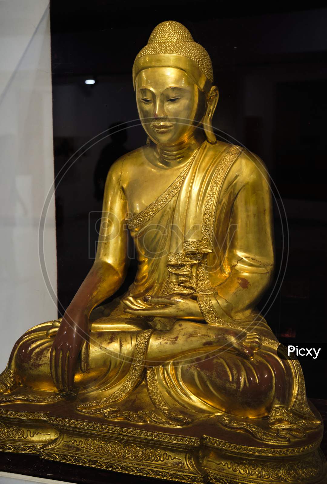 Gilded Statue Of A Buddha In The National Museum Of India In New Delhi