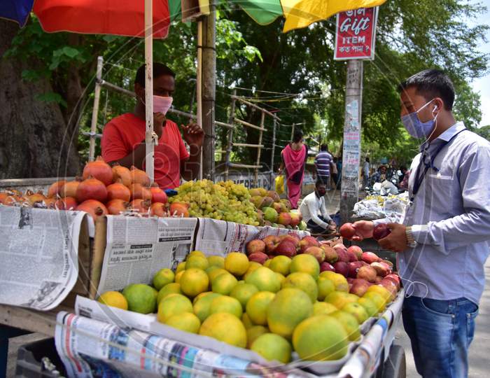 A Vendor sells Fruits  After Authorities Allowed Sale  With Certain Restrictions, During The Ongoing Covid-19 Or Coronavirus  Nationwide Lockdown In Nagaon District Of Assam On May 04,2020
