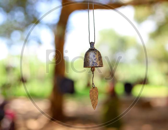 Selective Focus on Hanging Bell with Blur Background