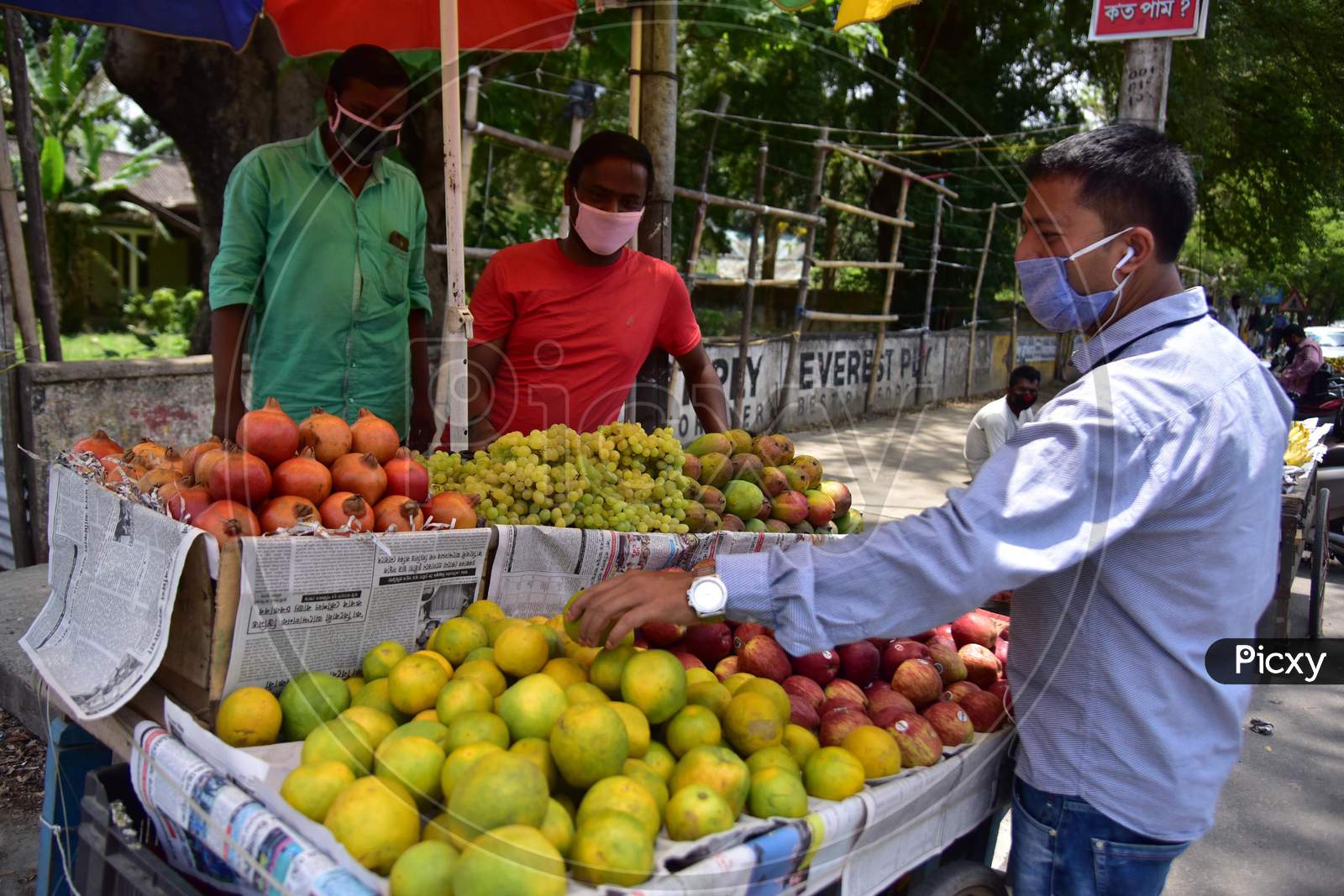 Nagaon :Vendor Sale Fruits  After Authorities Allowed Sale  With Certain Restrictions, During The Ongoing Covid-19 Nationwide Lockdown In Nagaon District Of Assam On May 04,2020 .Pix By Anuwar Hazarika