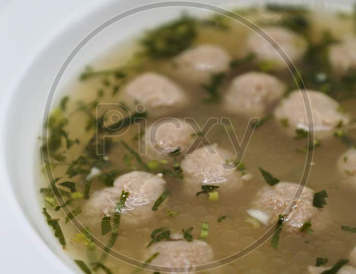 soya chunks with soup served in a White Bowl