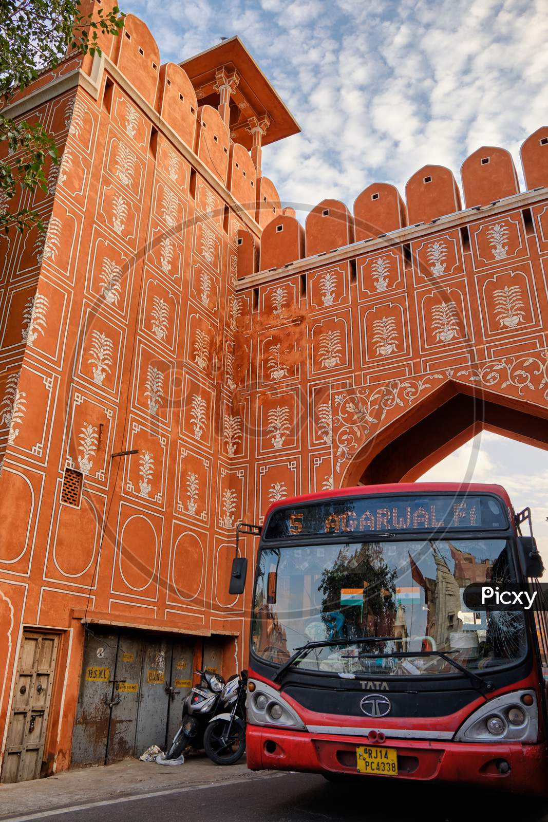 Public Bus Passes Through The Chandpole Gate Of The Walled City Of Jaipur, Pink City In India