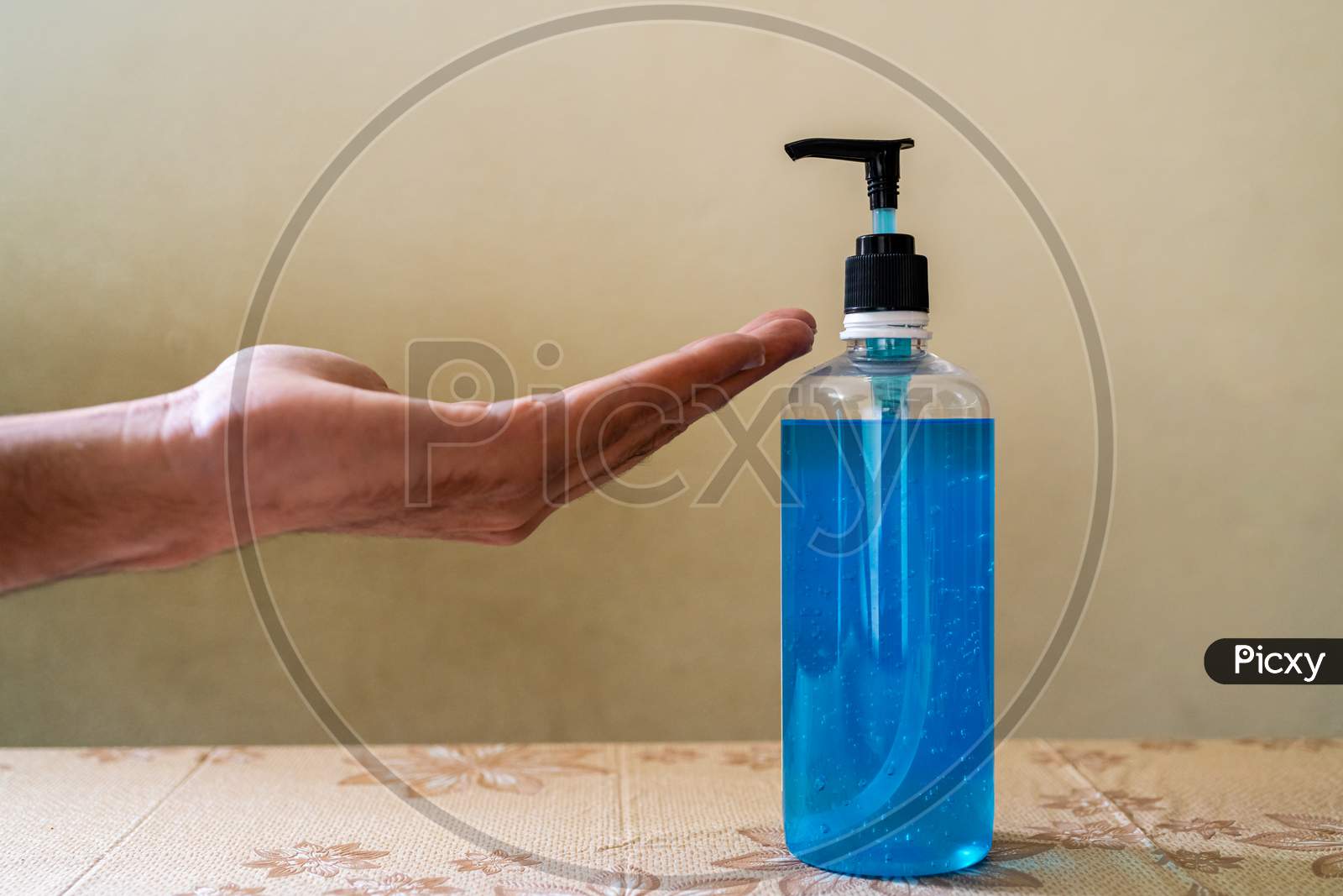 A bottle of hand sanitiser with hand
