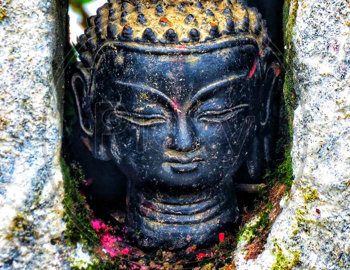 Close up an Ancient Buddha Statue.