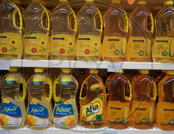 Bottles Of Cooking Oils For Sale. Corn, Sunflower, Extra Virgin Olive Oils. Rows Of High Quality Healthy Cooking Oil. Variety Brand Of Cooking Oil On Display Rack, Shelf  India