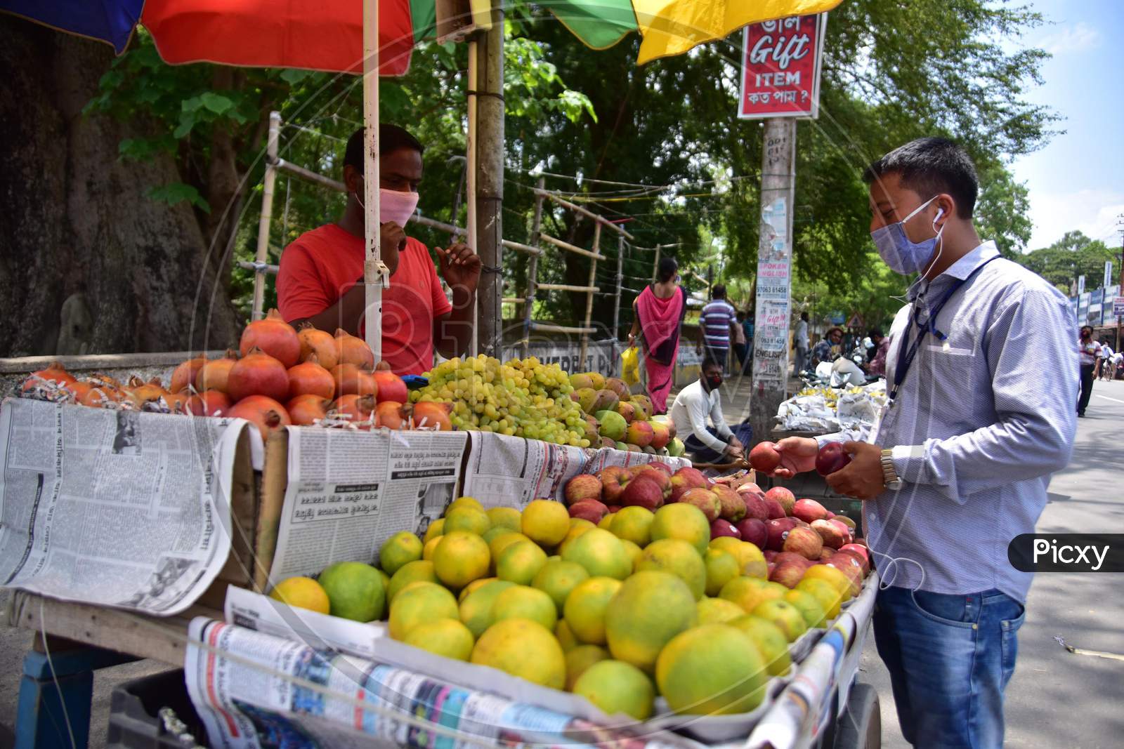 A Vendor sells Fruits  After Authorities Allowed Sale  With Certain Restrictions, During The Ongoing Covid-19 Or Coronavirus  Nationwide Lockdown In Nagaon District Of Assam On May 04,2020