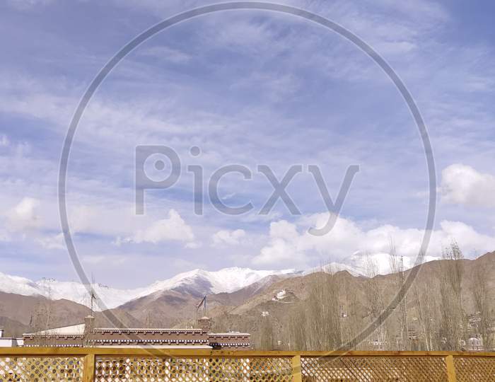 Leh city with mountains background from Leh Palace located in Leh, Ladakh, Jammu and Kashmir, India.
