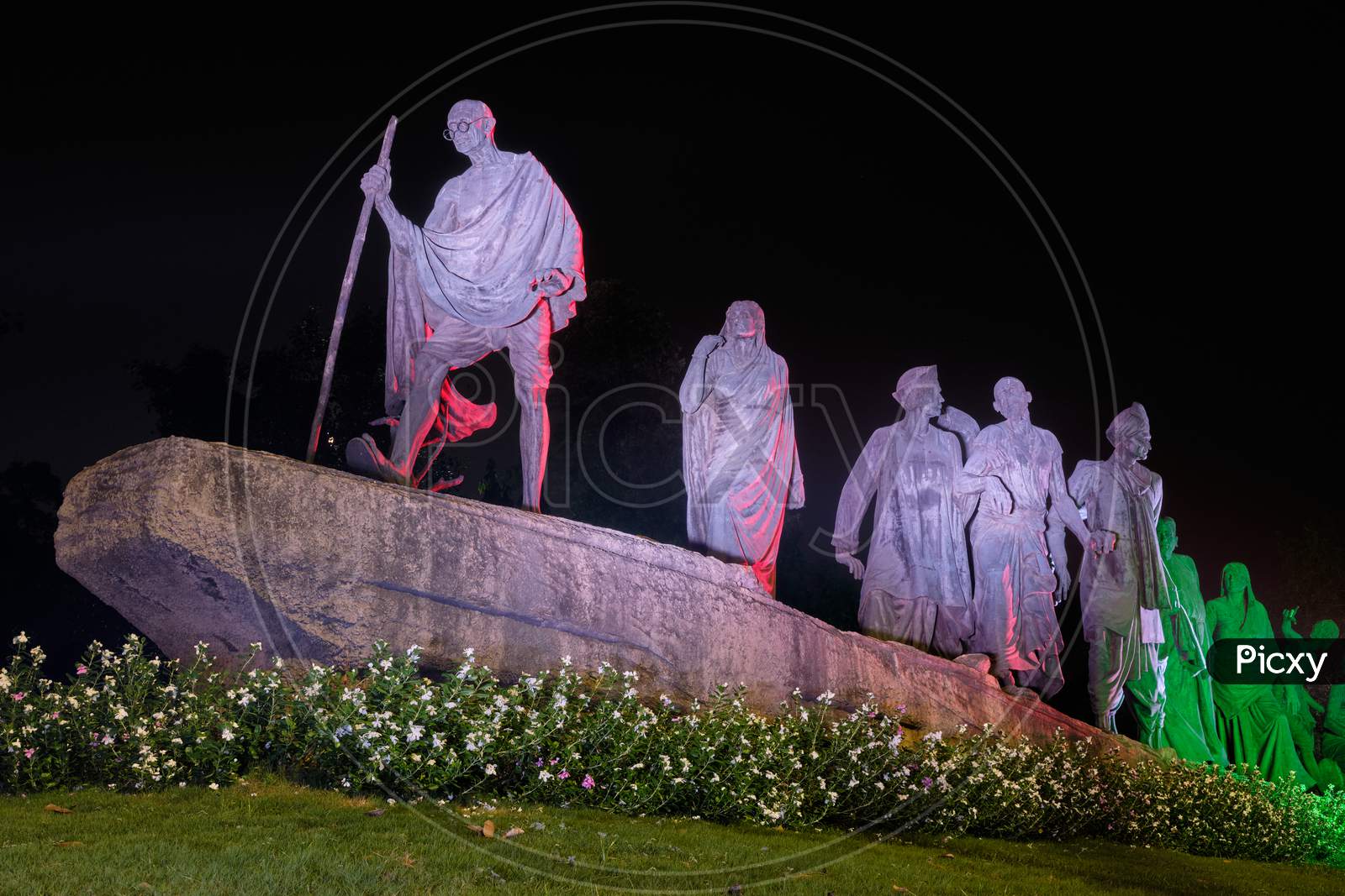 Dandi March Statue Illuminated At Night, Commemorating The Salt March Of 1930, With Gandhi And His Followers In Peaceful Protest In New Delhi, India