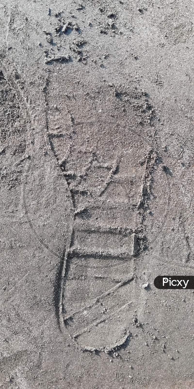 Shoe foot print in sand