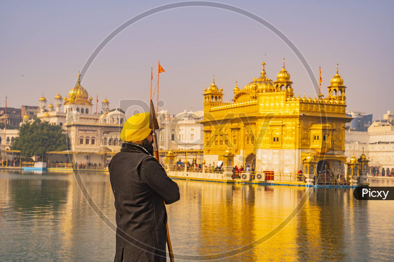 Sikh devotee as holy guard in the golden temple shri Harmandir Sahib in Amritsar, India Amritsar, Punjab, India