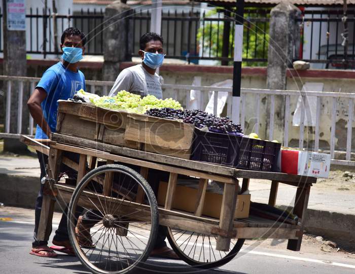 Nagaon :Vendor Carry Friuts On  His Cart  After Authorities Allowed Sale   With Certain Restrictions, During The Ongoing Covid-19 Nationwide Lockdown In Nagaon District Of Assam On May 04,2020 ..Pix By Anuwar Hazarika