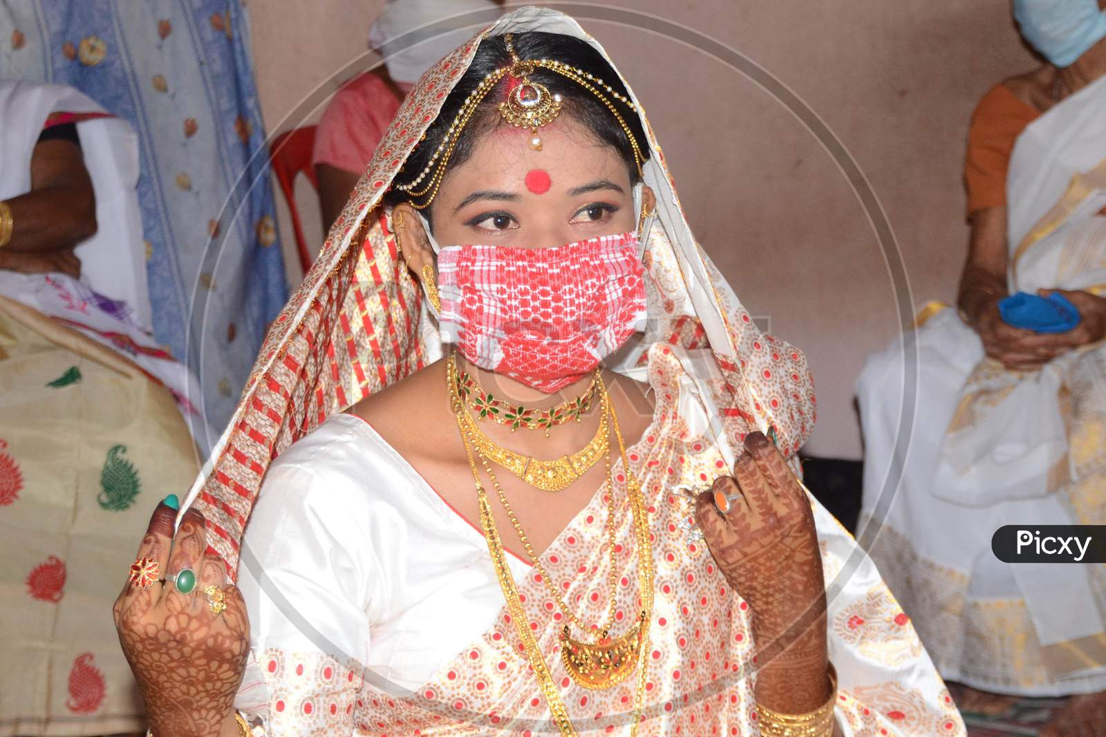 An  Assamese  Bride  Wearing Mask On Her Wedding During The Ongoing Covid-19 Nationwide Lockdown At Bishnupur In Nagaon District Of Assam On May 03,2020
