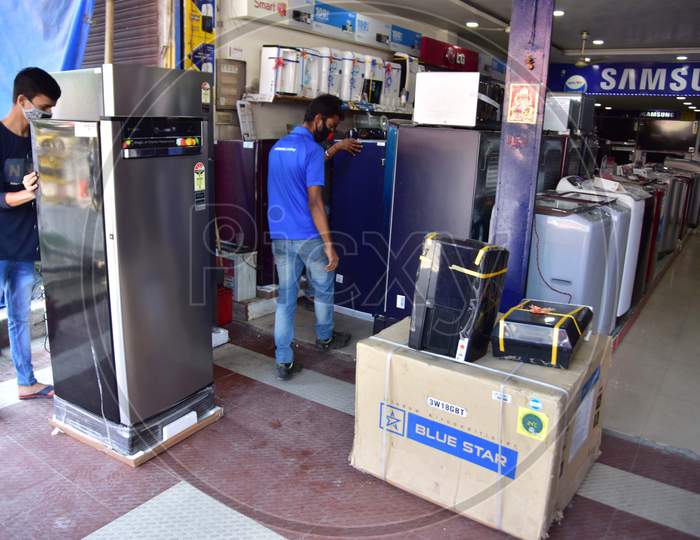 Workers Arrange Their Electronics Items  After Authorities Allowed Sale  With Certain Restrictions, During The Ongoing Covid-19 or Coronavirus  Nationwide Lockdown In Nagaon District Of Assam On May 04,2020