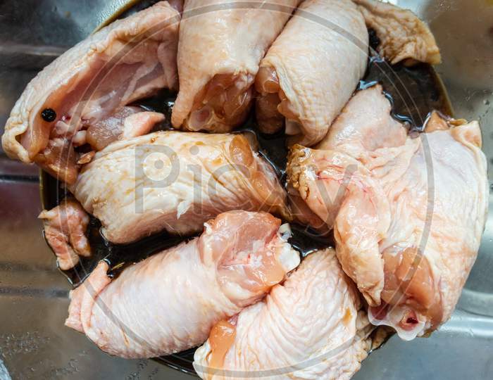 Raw chicken marinating