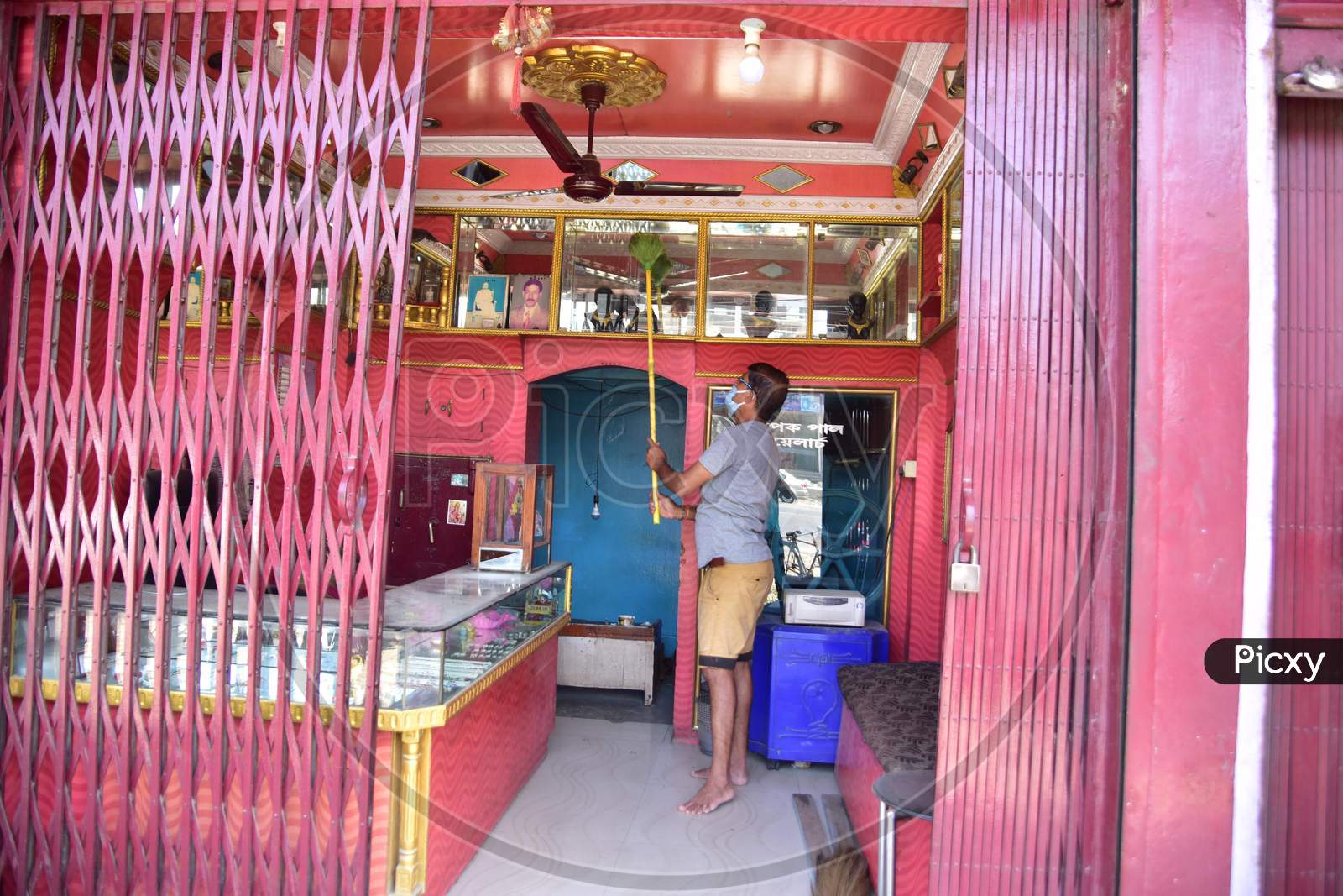 A  Man Cleans His Jewelry Shop  After Authorities Allowed Sale  With Certain Restrictions, During The Ongoing Covid-19 or Coronavirus  Nationwide Lockdown In Nagaon District Of Assam On May 04,2020 .