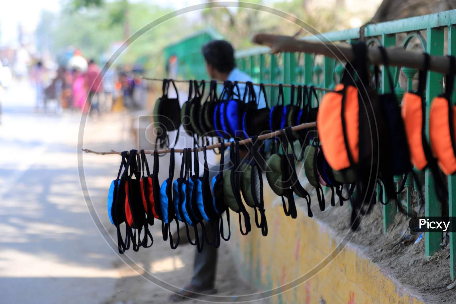 Masks hanging for sale on the road side during an extended nationwide lockdown to slow the spread of the Coronavirus disease or COVID-19, in Prayagraj, May 4, 2020.