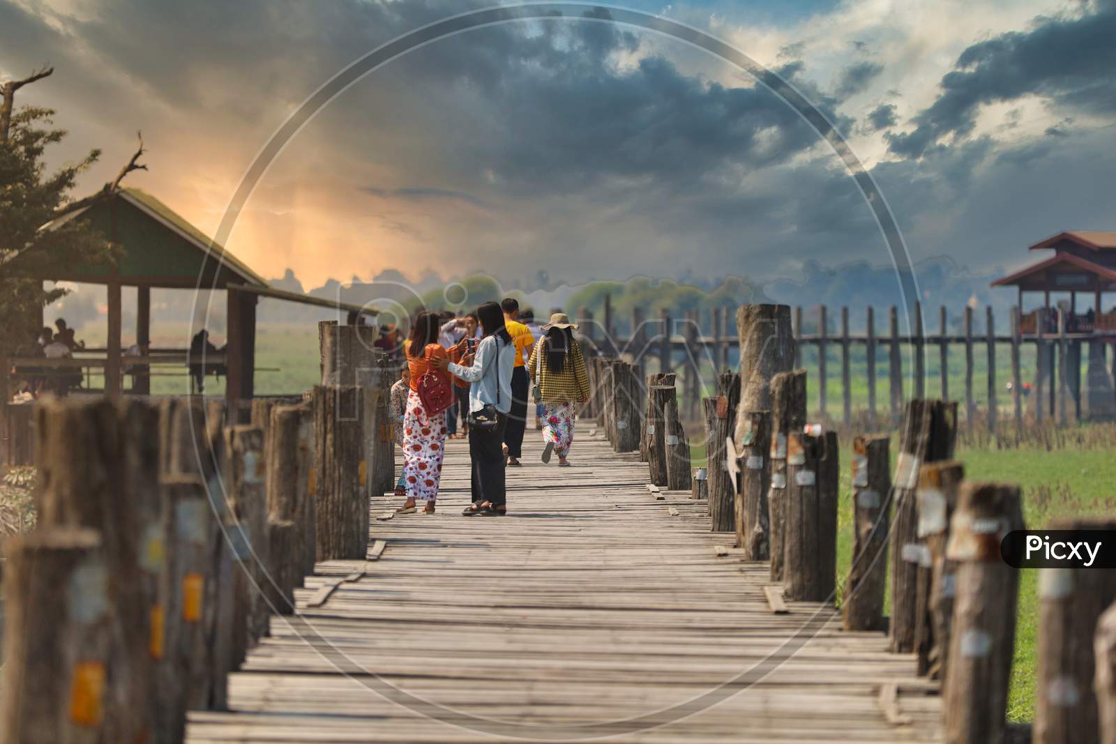 People walking on a Wooden Bridge