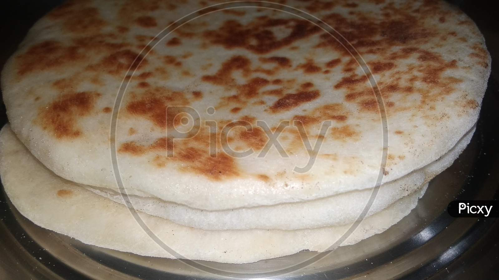 Bazlama tortilla ingredient backed naan roti dish. Selective focus