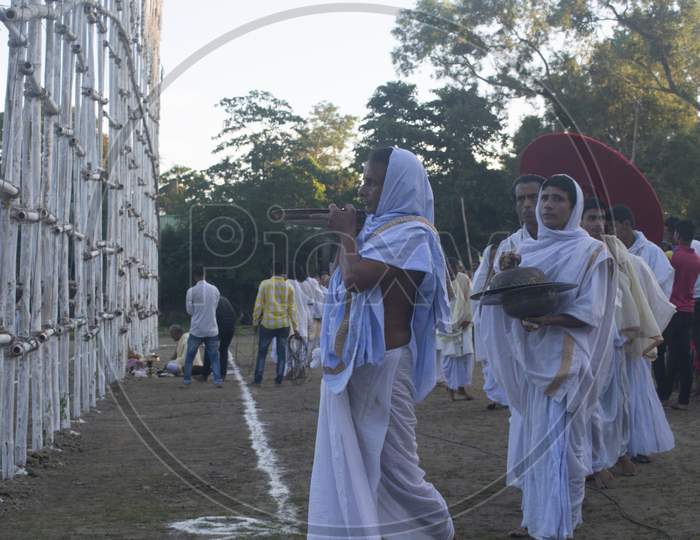 Majuli, Assam/India- October 18 2018: The Satradhikar and the disciples of Sri Sri Auniati Satra, Majuli lighting the sky lamps (akash bonti) on the Occasion of Kati Bihu at Auniati Satra.