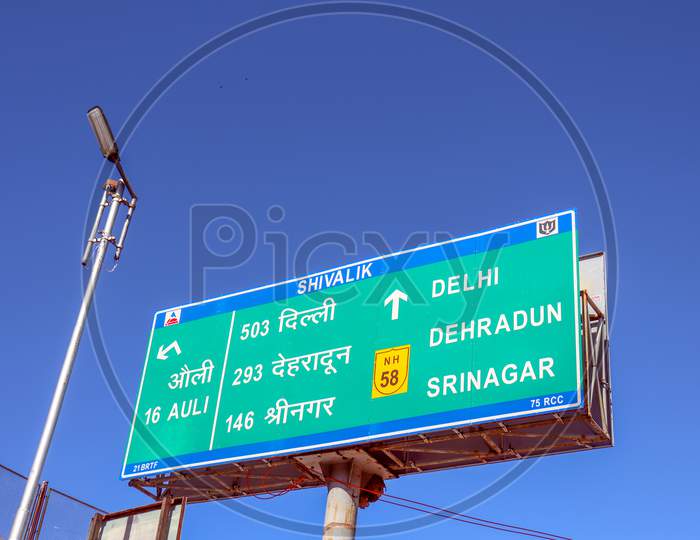 Auli ,Uttarakhand /India-March 16,2020: A Symbolic Board On A National Highway Roadside Distance Of Certain Places From The Place New Delhi
