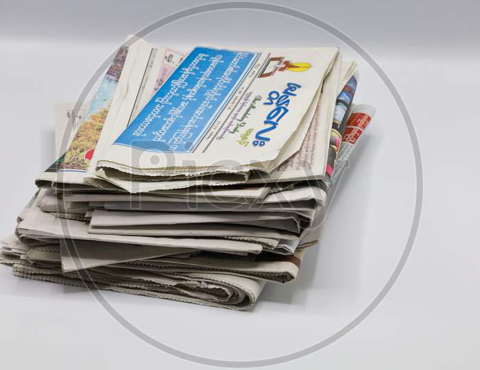 A Bundle of Newspapers isolated on white background