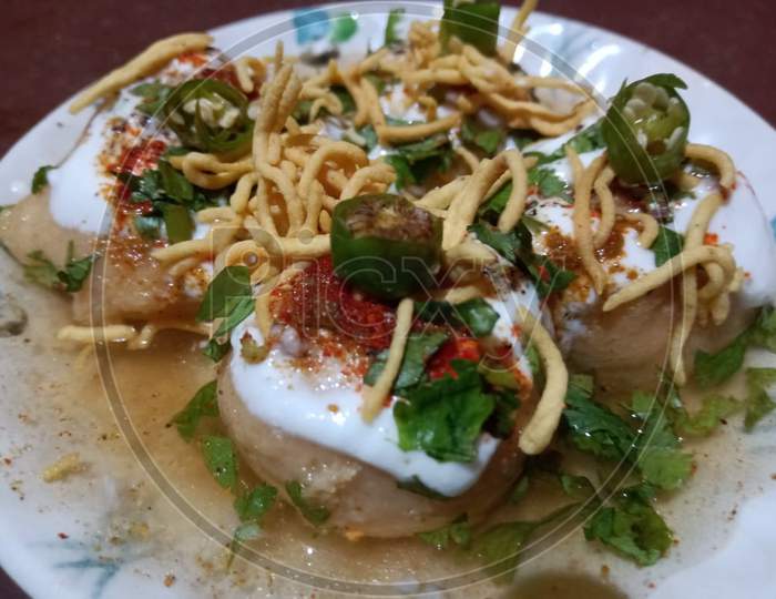 Chinese ingredient dahi vada dish with noodle, green chili and mix masala