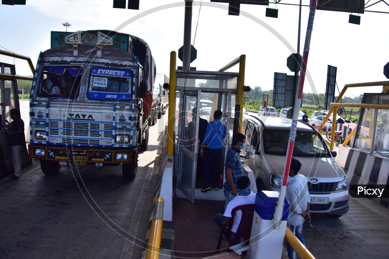 Vehicles Waiting To Pass Through  A Toll Plaza Of The National Highway Authority Of India (Nhai )After Authorities Allowed   With Certain Restrictions  During The Ongoing Covid-19 or Coronavirus  Nationwide Lockdown In Nagaon District Of Assam On May 4,2020