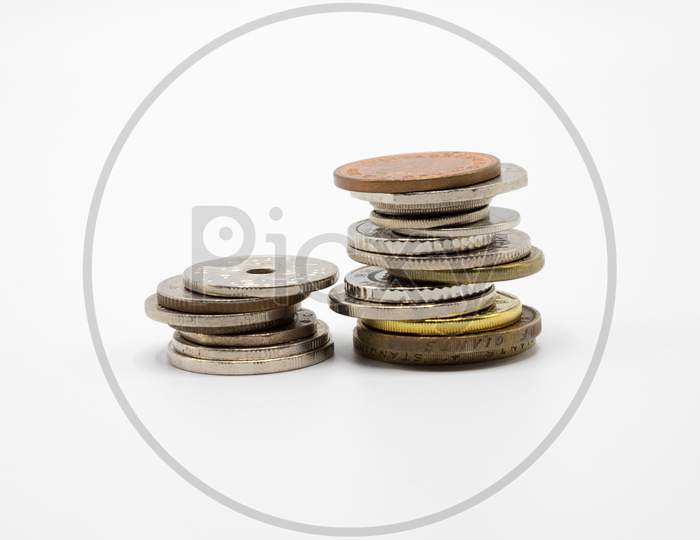 A pile of Currency Coins on White Background