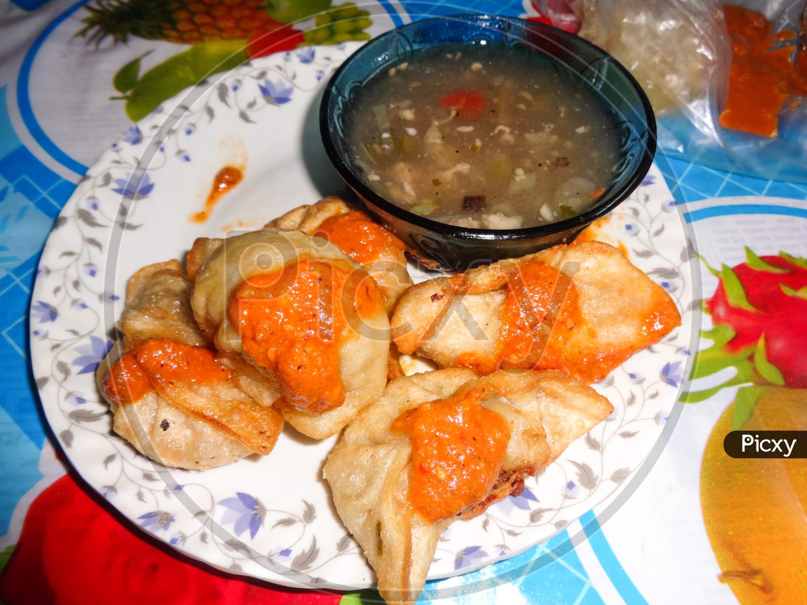 One dish of indian food momos tasty and crunchy. With chicken soup