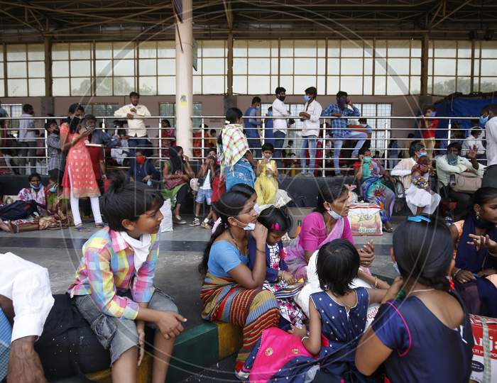 People wait for buses at a bus station during the nationwide lockdown to stop the spread of Coronavirus (COVID-19) in Bangalore, India, May 02, 2020.