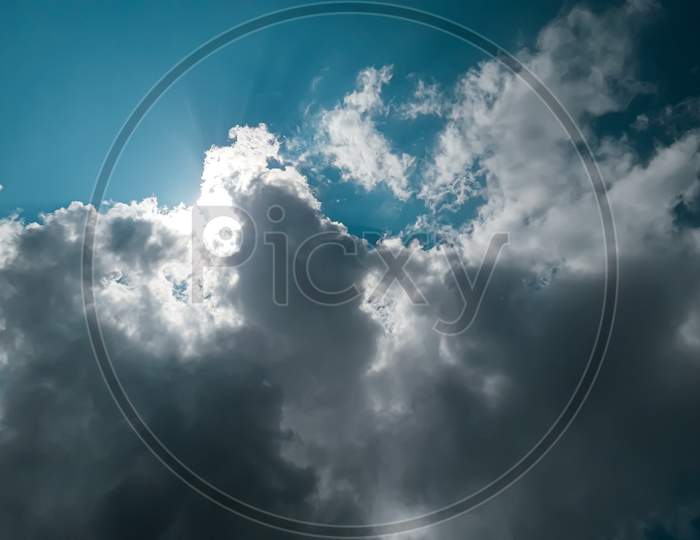 Sunshine behind the cloud with blue sky
