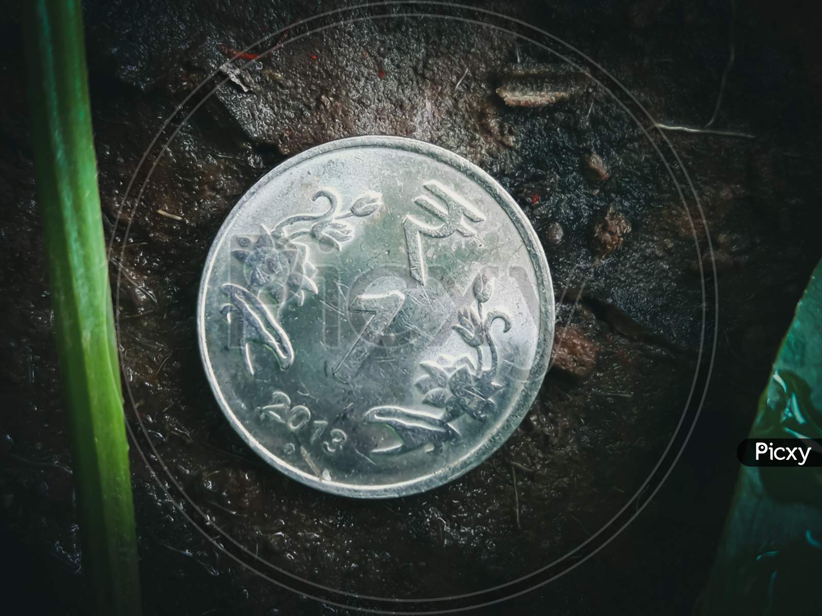 Shining 1 Rupee Coin In The Soil With Dust