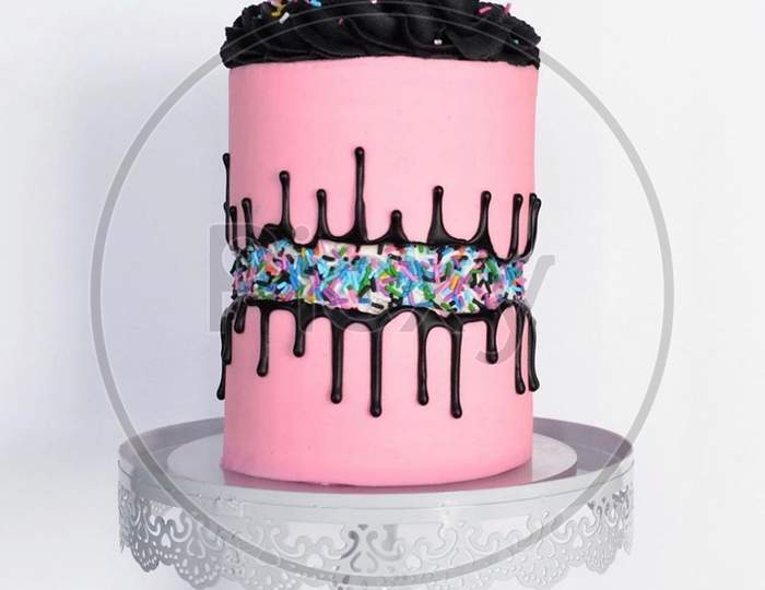 A pink chocolate birthday cake