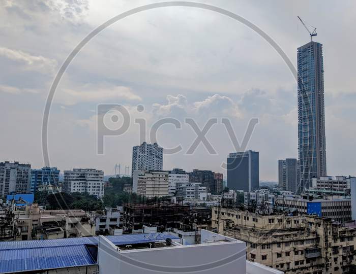 Landscape view of kolkata, The 42 building , Victoria memorial , clouds touch the tall building, A building in under construction