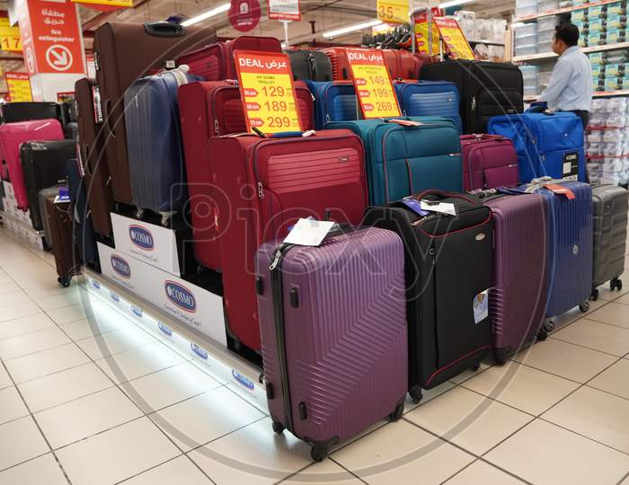 Department Store Interior View With Luggage Zone. Multicolored Suitcases In Store For Sale. Plastic And Cloth Suitcases With Discount Tags. Concept Of Black Friday Discounts India