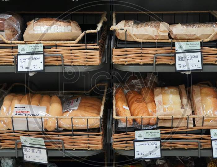 Different Fresh Bread On The Shelves In Bakery. Interior Of A Modern Grocery Store Showcasing The Bread Aisle With A Variety Of Prepackaged Breads Available. :India