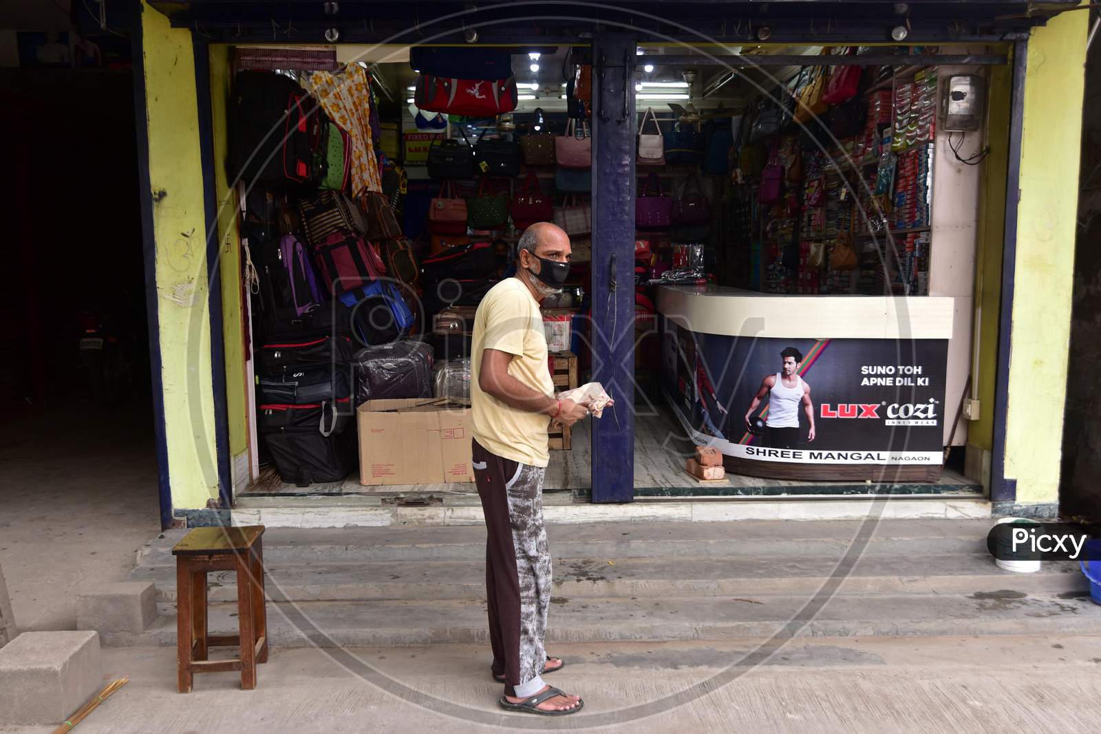 A Shopkeeper Waits For Customers  That Was Opened As Per The Relaxed Covid-19 Or Coronavirus Nationwide Lockdown Guidelines, In Nagaon District Of Assam On  May 5, 2020.