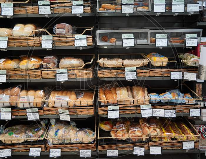 Different Fresh Bread On The Shelves In Bakery. Interior Of A Modern Grocery Store Showcasing The Bread Aisle With A Variety Of Prepackaged Breads Available. :India
