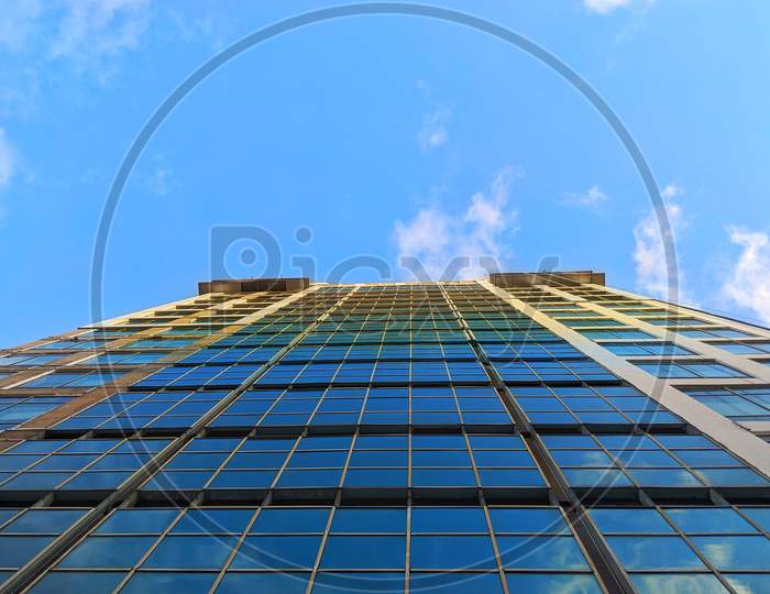 Tall building is touching the blue sky, DLF IT park in Kolkata, sky reflection on glass of building