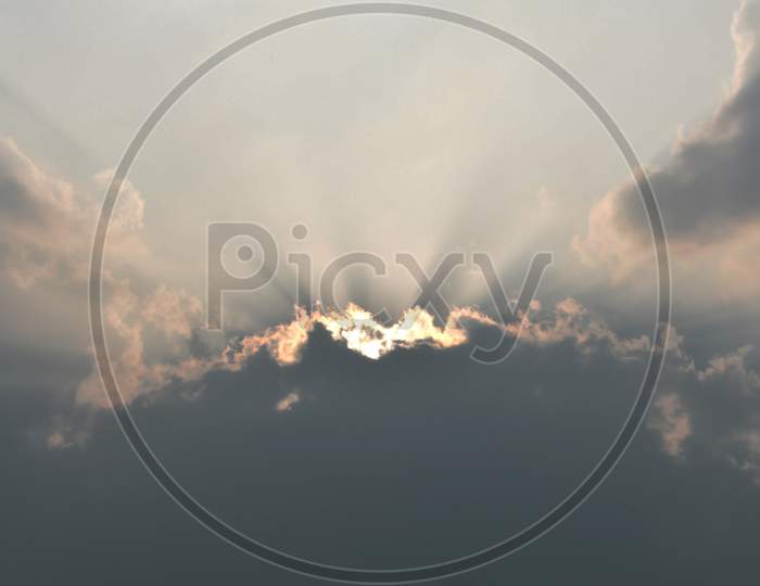Stock Image Of The Sun ,Coming Out From The Dark Clouds