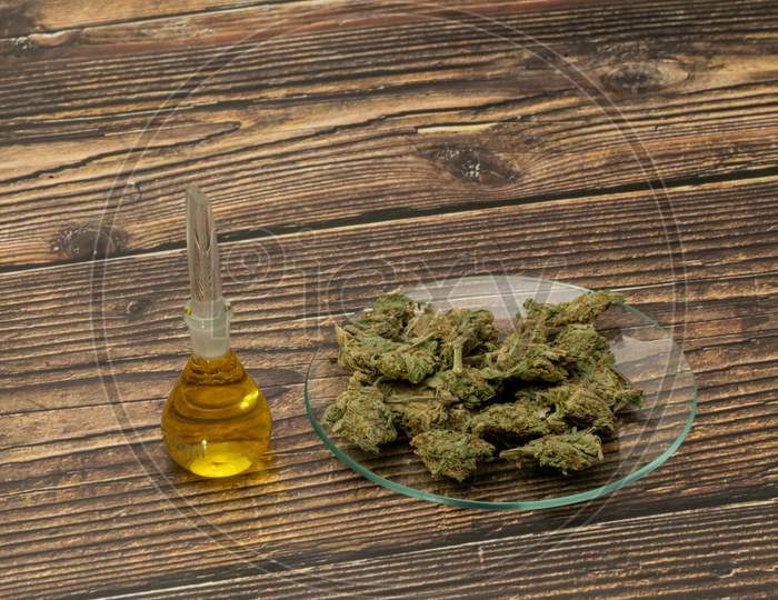 Marijuana Cannabis Medicinal, Weed Joint In A Glass Container. Medical Extract Of Cannabis Marijuana Oil In Jar