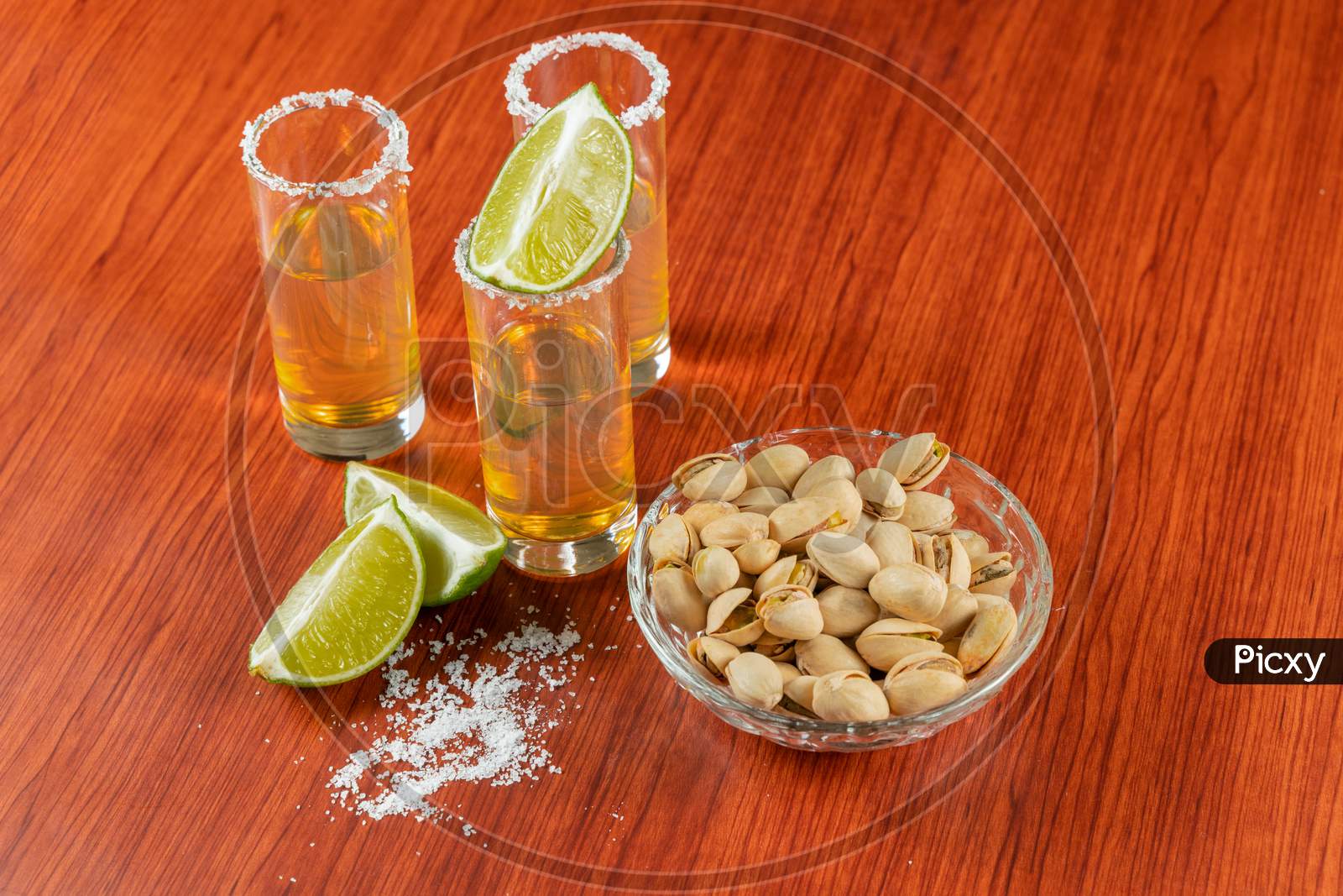 Golden Tequila With Lemon, Pistachos, Cacahuate, And Salt. Drinks, Liquor
