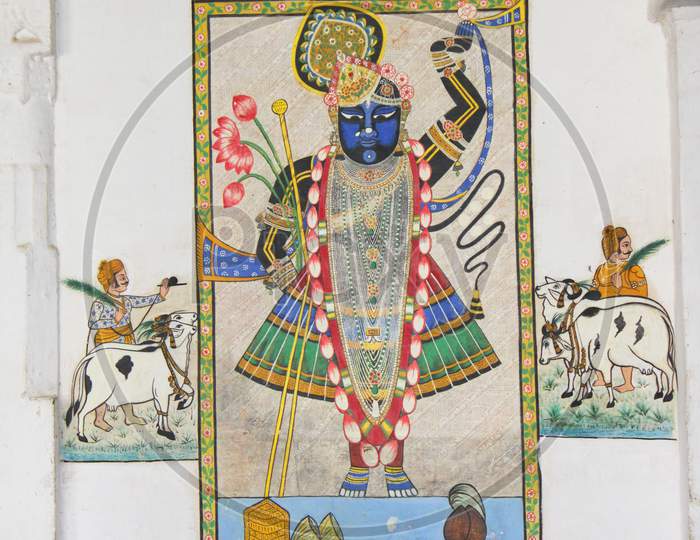 An old wall painting of God Shrinathji inside City palace in Udaipur, Rajasthan, India.
