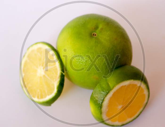 mosambi sweet lime fruit with white background half cut