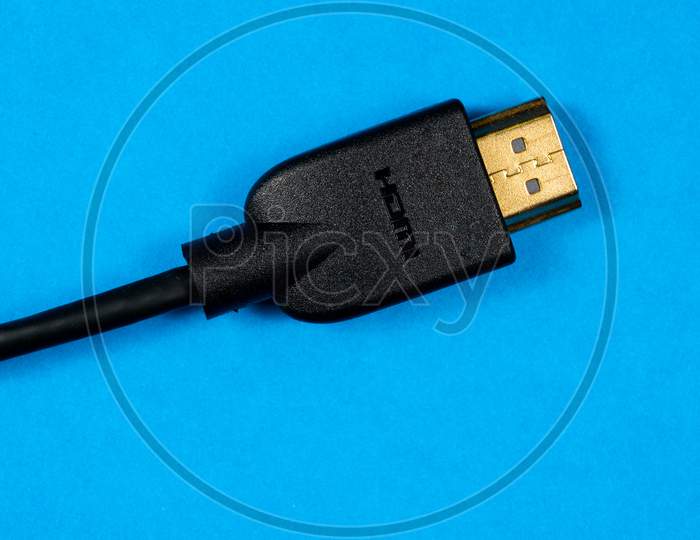 Hdmi Cable With Gold Plated Connectors On Blue Background