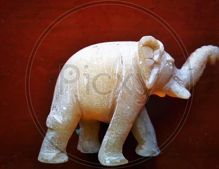 Elephant statue small red background