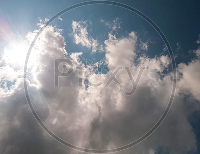 Sunshine behind the Smokey  cloud with blue sky