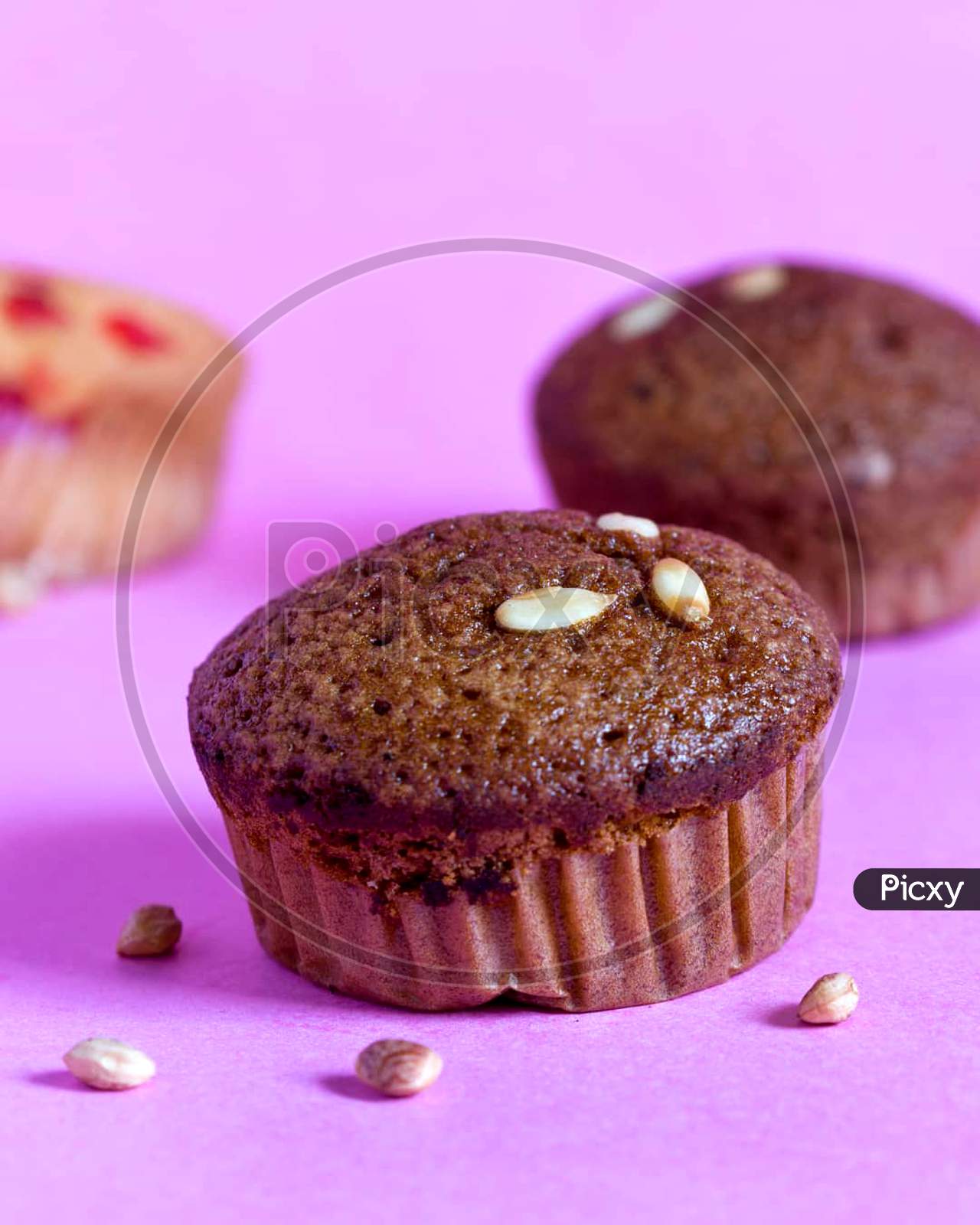 Chocolate cupcakes month watering with dry fruits in toppings