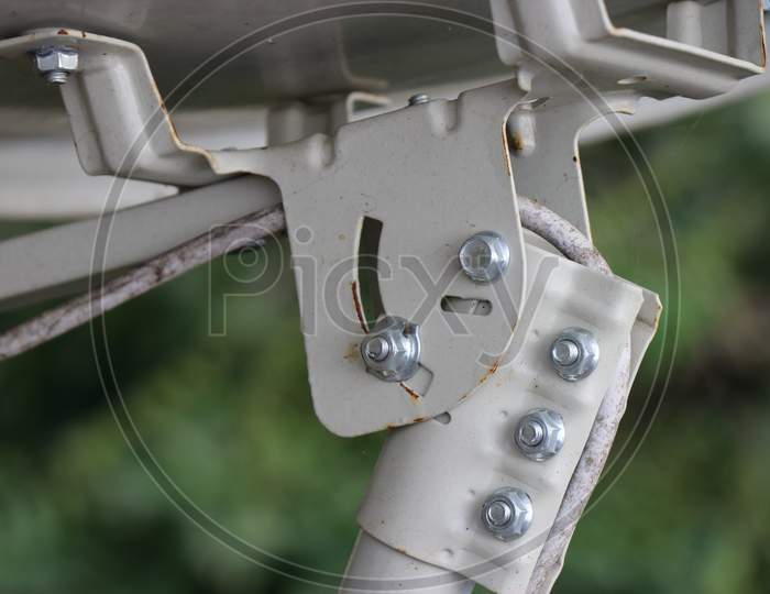 Antenna Used In Television Dish Attached To Base Using Small Nuts And Bolts Close Up Shot